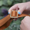 Anti-theft jacquard strap in brown old, demonstration of adjustable length
