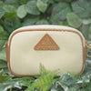 Anti-theft water resistant Mini Crissy Crossbody. Demonstration of water resistant nylon with water running down the fabric